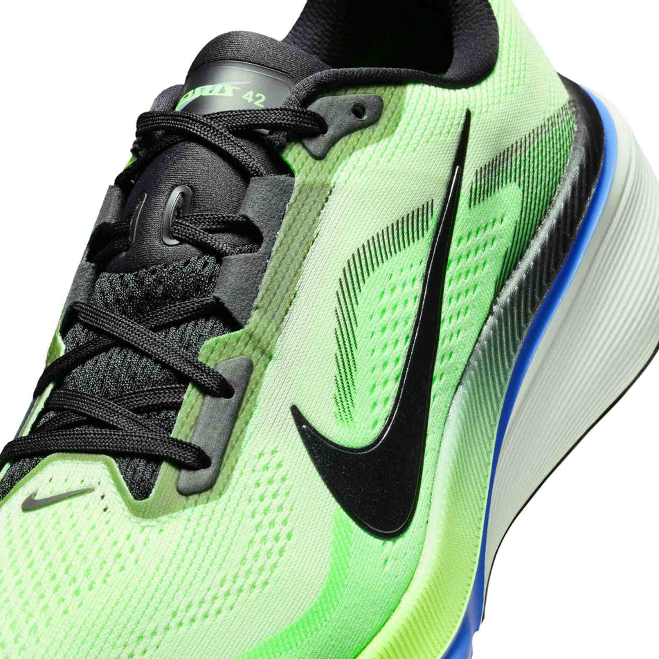 Close-up view of the upper of the left shoe from a pair of Nike Men's Pegasus 42 Road Running Shoes in the Volt Tint/Black Spruce-Sapphire colourway.