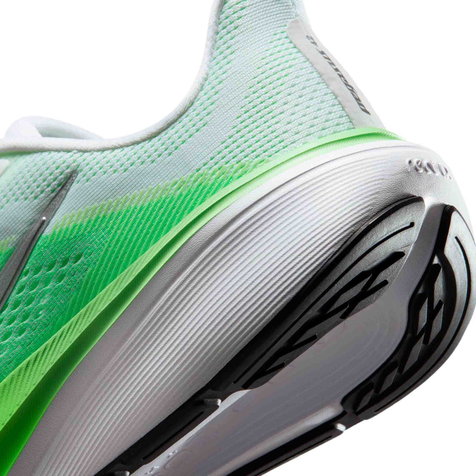 Close-up view of the rearfoot section of the left shoe from a pair of Nike Women's Pegasus 42 Road Running Shoes in the White/Metallic Silver-Green Strike colourway.