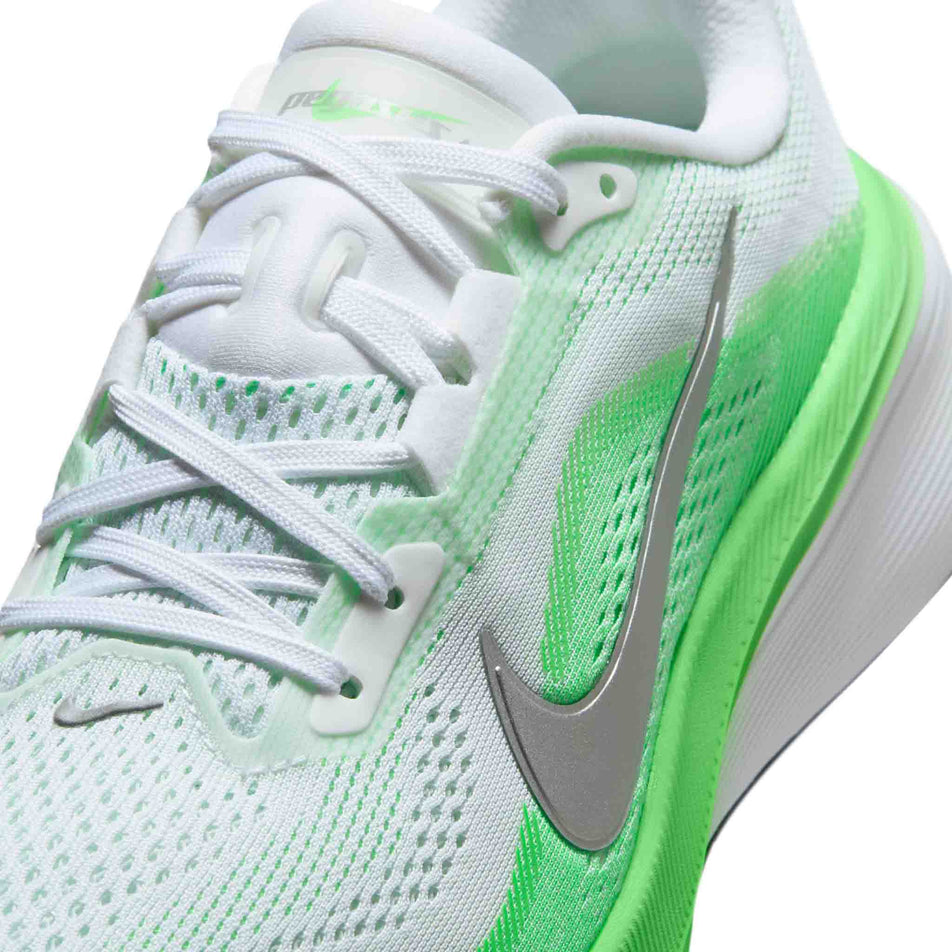 Close-up view of the upper of the left shoe from a pair of Nike Women's Pegasus 42 Road Running Shoes in the White/Metallic Silver-Green Strike colourway.