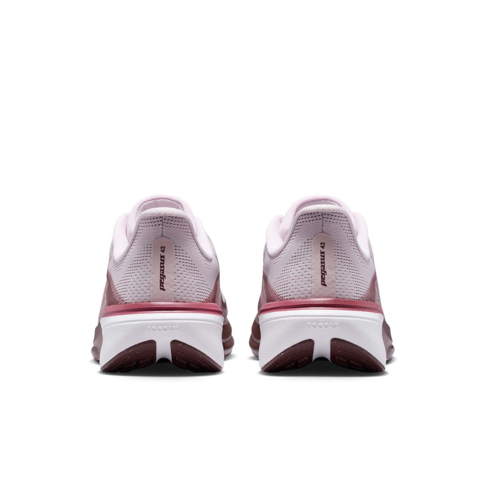 The back of a pair of Nike Women's Pegasus 42 Road Running Shoes in the Bleached Lilac/Pink Rise-Mystic Dates colourway.