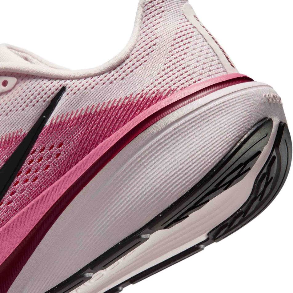 Close-up view of the rearfoot section of the left shoe from a pair of Nike Women's Pegasus 42 Road Running Shoes in the Pearl Pink/Black-Peony-Team Crimson colourway.