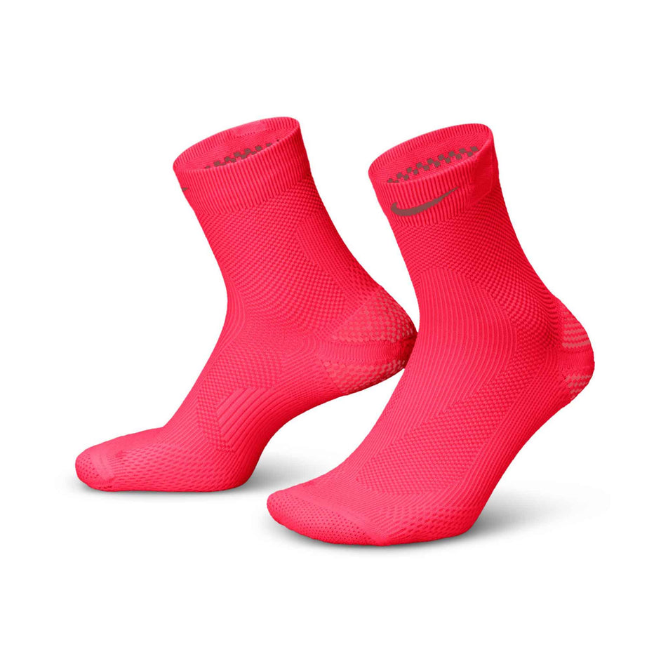 A pair of Nike Lightweight Running Micro Crew Socks in the Laser Crimson/Light Crimson/Pink Smoke colourway.