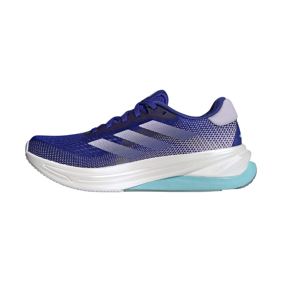 Medial side of the right shoe from a pair of adidas Women's Supernova Solution Running Shoes in the Lucid Blue/Purple Tint/Flash Aqua colourway. (8472655724706)