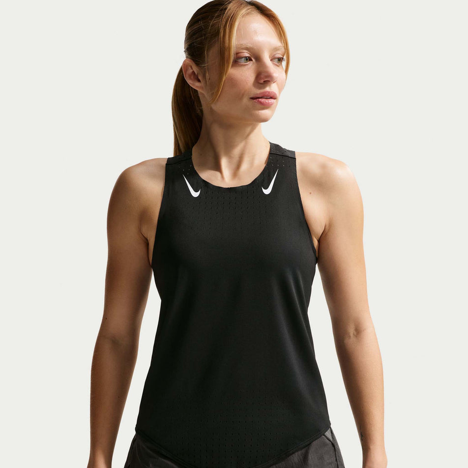 Front view of a model wearing the Nike Women's AeroSwift Dri-FIT ADV Running Singlet in the Black/White colourway.