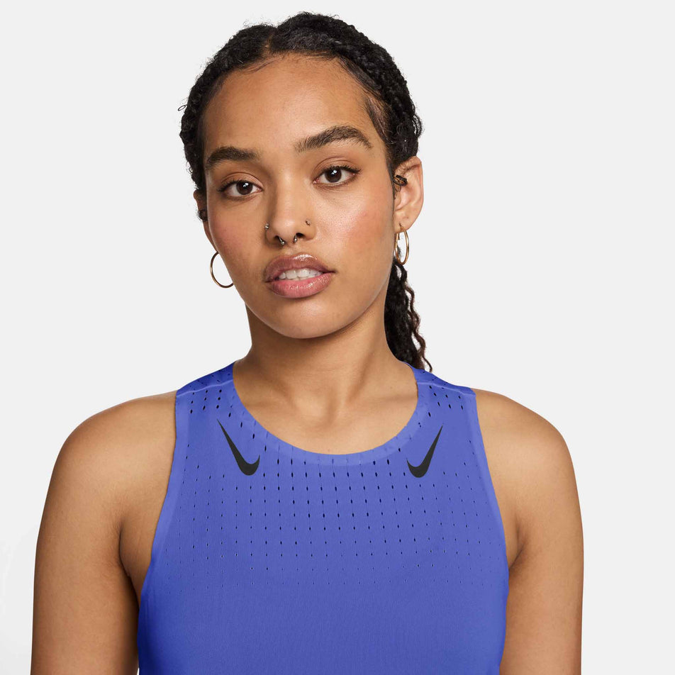 Front view of a model wearing the Nike Women's AeroSwift Dri-FIT ADV Running Singlet in the Sapphire/Black colourway.