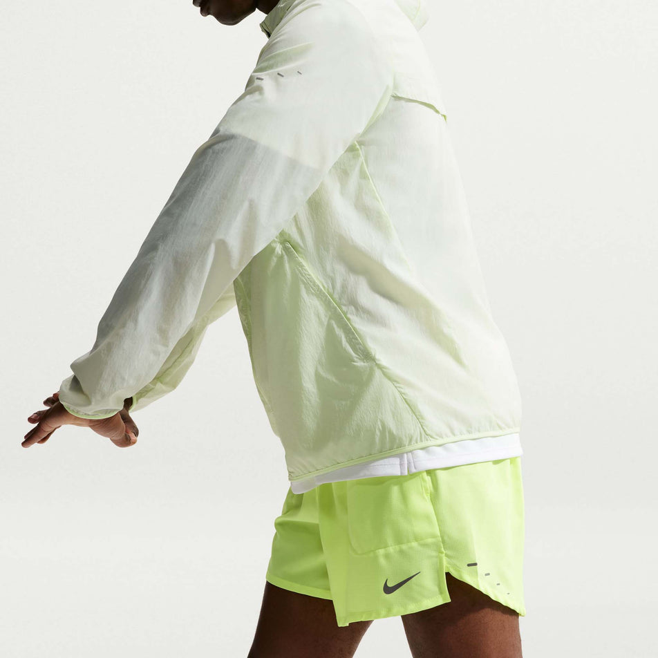 Side view of a model wearing the Nike Men's Stride Dri-FIT 5
