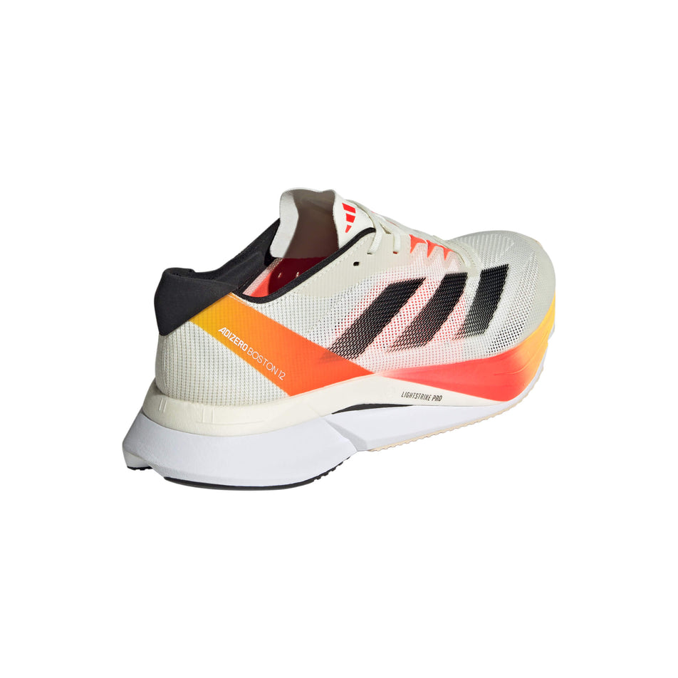 Lateral side of the right shoe from a pair of adidas Women's Boston 12 Running Shoes in the Ivory/Iron Met./Solar Red colourway (8192164298914)