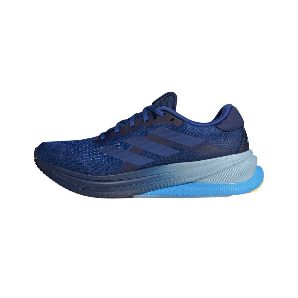 Medial side of the right shoe from a pair of adidas Men's Supernova Solution Running Shoes in the Team Royal Blue/Dark Blue/Blue Burst colourway (8192144146594)