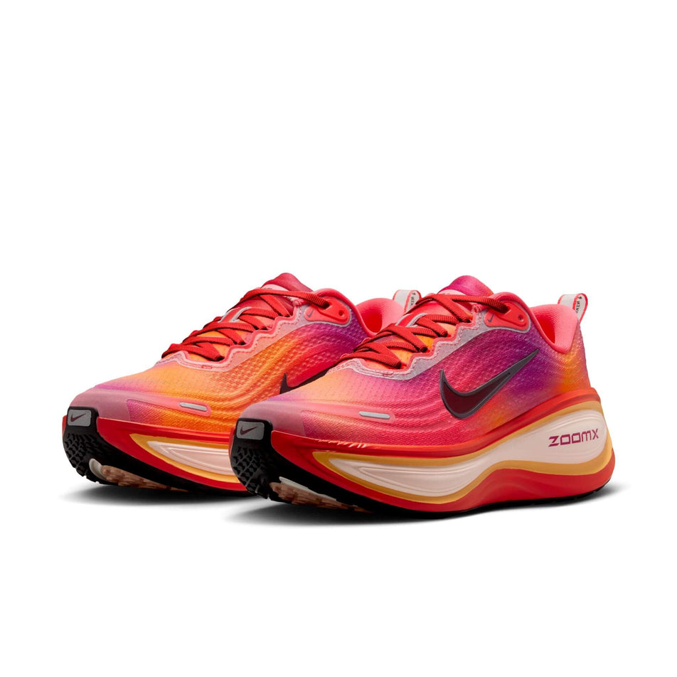 A pair of Nike Women's Vomero Plus SE Road Running Shoes in the Ember Glow/Bordeaux-Marakesh colourway. (8764921872546)