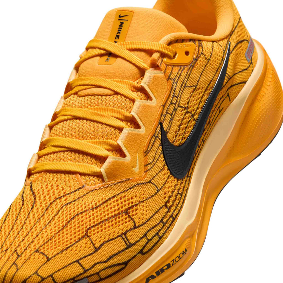 Close up view of the upper of the left shoe from a pair of Nike Men's Pegasus 41 LV8 Road Running Shoes in the University Gold/Black-Soft Yellow colourway. (8712397717666)