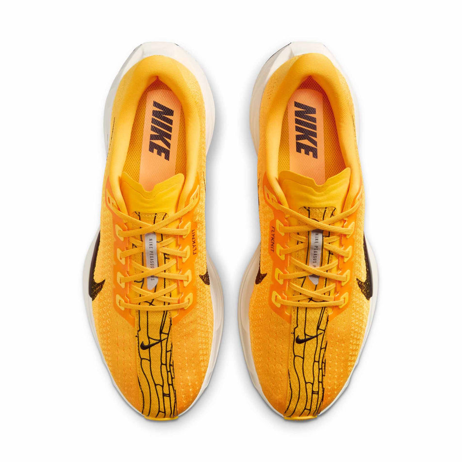 The uppers of a pair of Nike Men's Pegasus Plus LV8 Road Running Shoes in the University Gold/Black-Laser Orange Sail colourway. (8684355584162)
