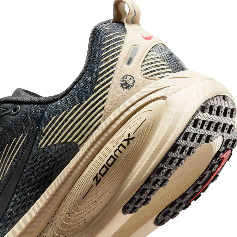 Close-up view of the medial side of the left shoe from a pair of Nike Men's Vomero 18 Road Running Shoes in the Oatmeal/Black-Anthracite-Volt colourway. (8684581552290)