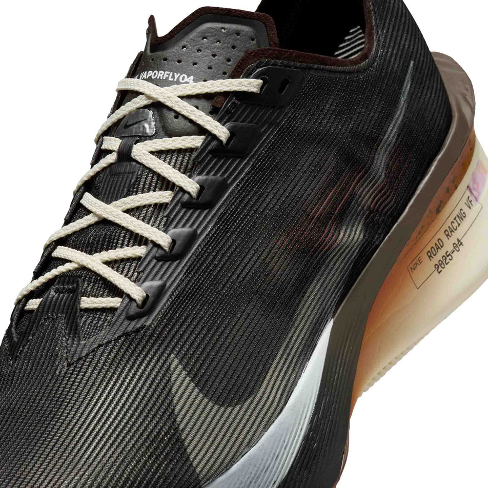 Close-up view of the upper of the left shoe from a pair of Nike Men's Vaporfly 4 Road Racing Shoes in the Velvet Brown/Soft Pearl-Black colourway. (8723634094242)