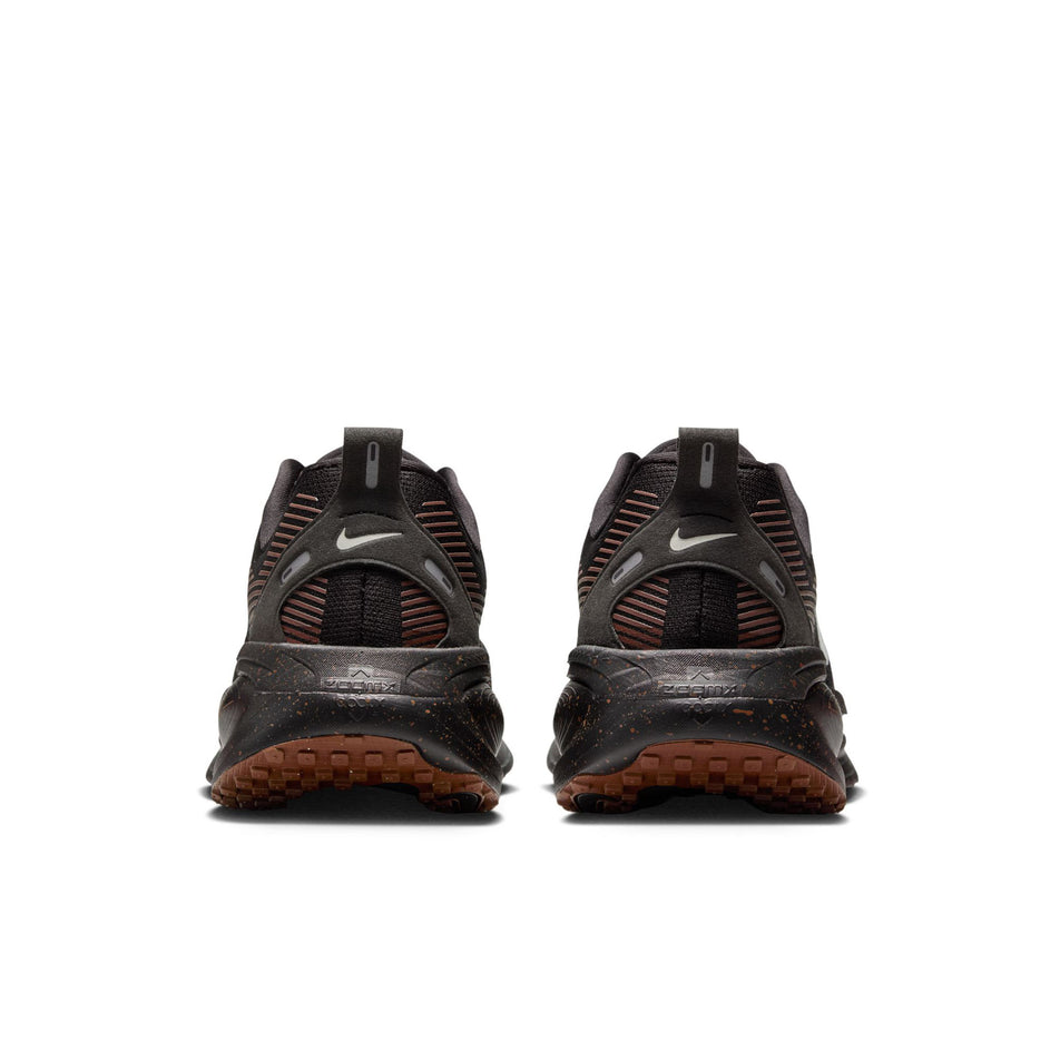 The back of a pair of Nike Men's Vomero 18 Road Running Shoes in the Black/Ironstone-Velvet Brown colourway. (8724276379810)