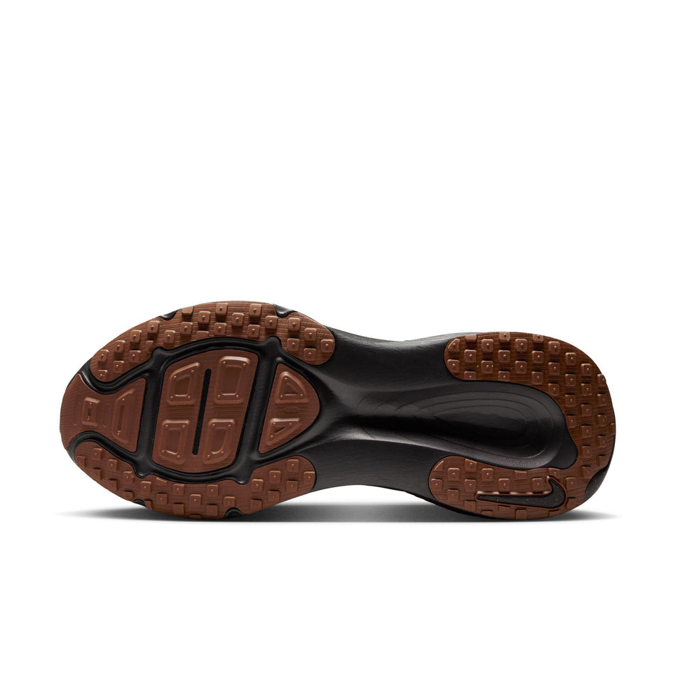 The outsole of the left shoe from a pair of Nike Men's Vomero 18 Road Running Shoes in the Black/Ironstone-Velvet Brown colourway. (8724276379810)