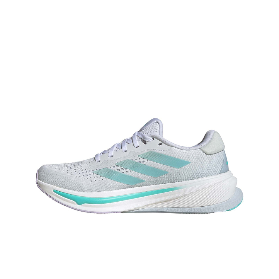 Medial side of the right shoe from a pair of adidas women's Supernova Rise Running Shoes in the Ftwr White/Linen Green Met./Flash Aqua colourway (8339206406306)