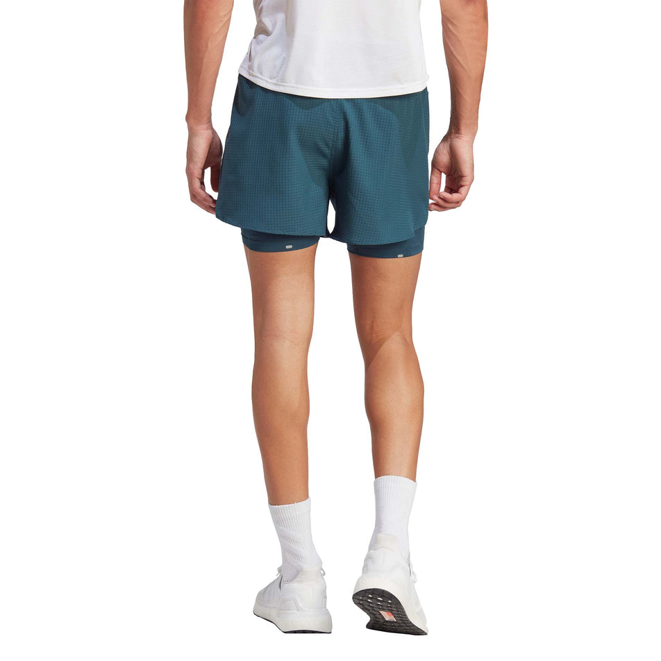 Back view of a model wearing a pair of adidas Men's Designed 4 Running 2-in-1 Shorts in the Arctic Night colourway (8005321064610)