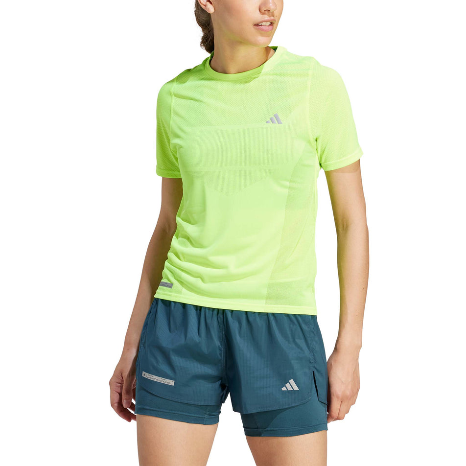 Front view of a model wearing an adidas Women's Ultimate Knit T-Shirt in the Lucid Lemon colourway (8005345771682)