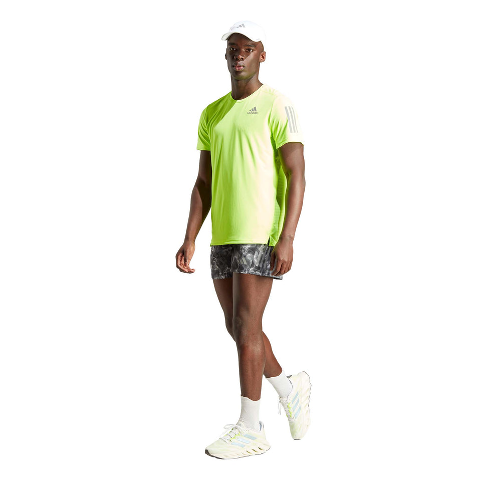 Front view of a model wearing an adidas Men's Own the Run Tee in the Lucid Lemon colourway (8005317394594)