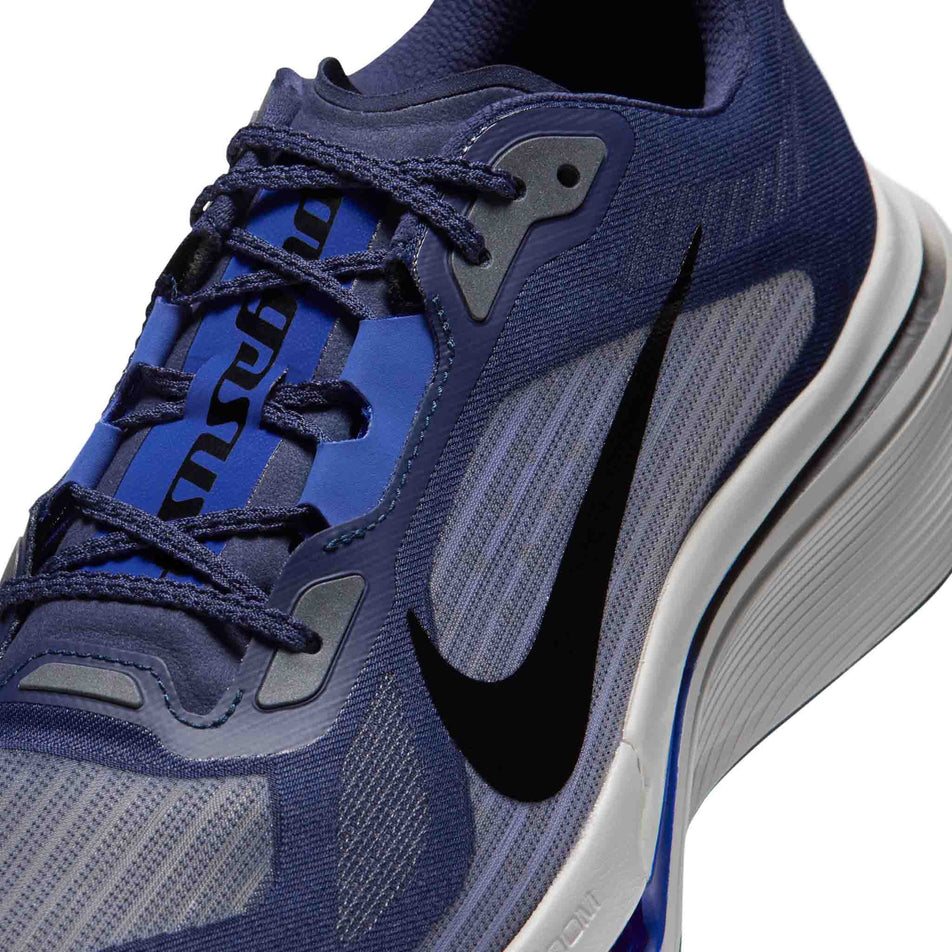 Close-up view of the upper of the left shoe from a pair of Nike Men's Pegasus Plus 2 Road Running Shoes in the Midnight Navy/Black-Racer Blue-Grey Mist colourway.