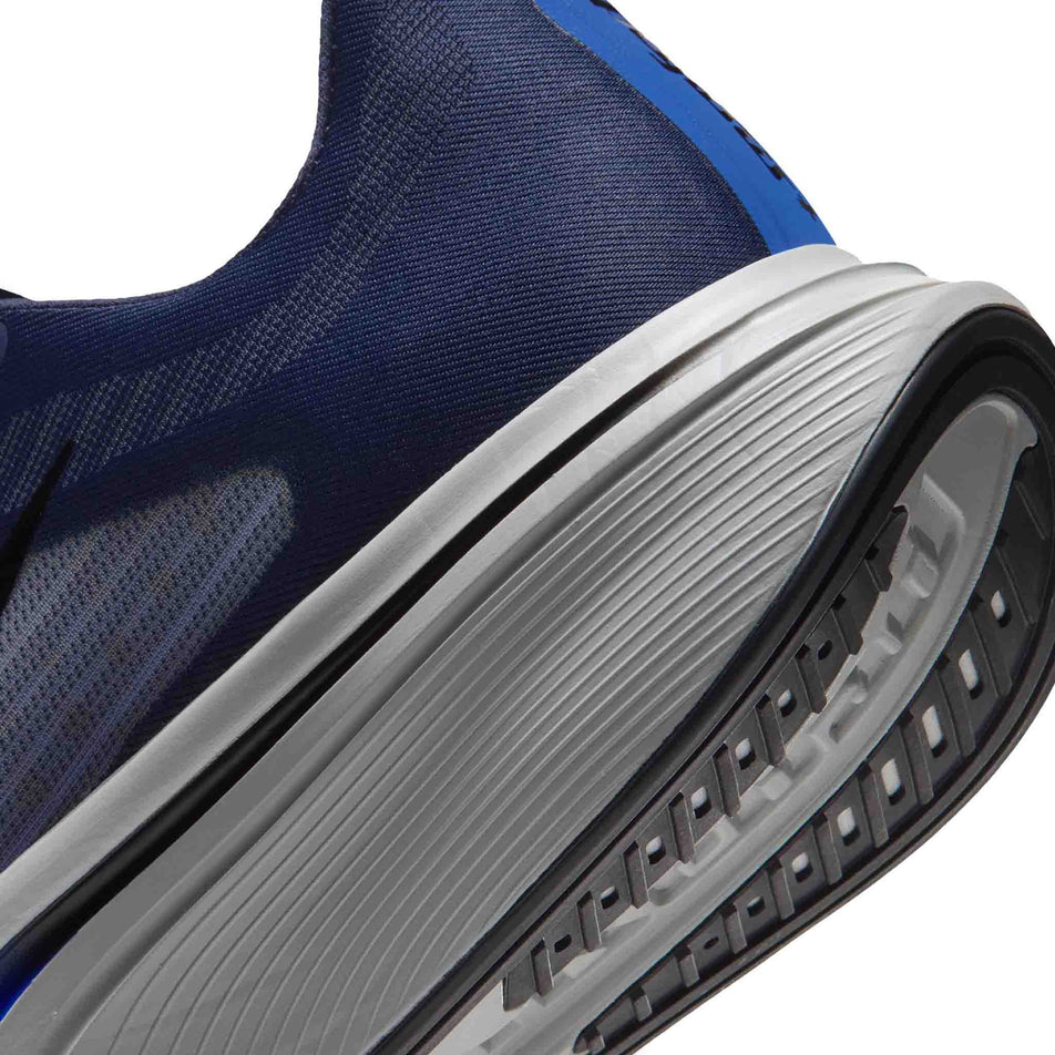 Close-up view of the rearfoot section of the left shoe from a pair of Nike Men's Pegasus Plus 2 Road Running Shoes in the Midnight Navy/Black-Racer Blue-Grey Mist colourway.