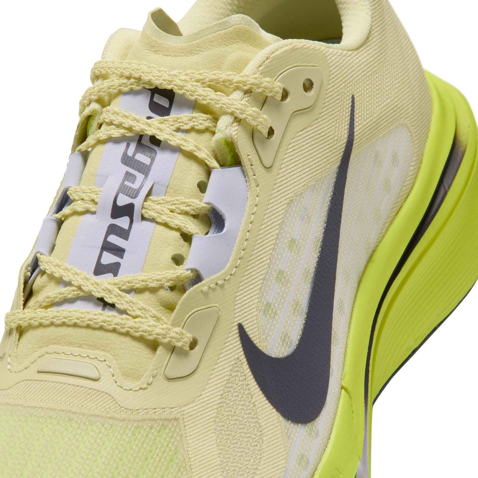 Close-up view of the upper of the left shoe from a pair of Nike Women's Pegasus Plus 2 Road Running Shoes in the Fennel/Gridiron-Lemon Venom colourway.