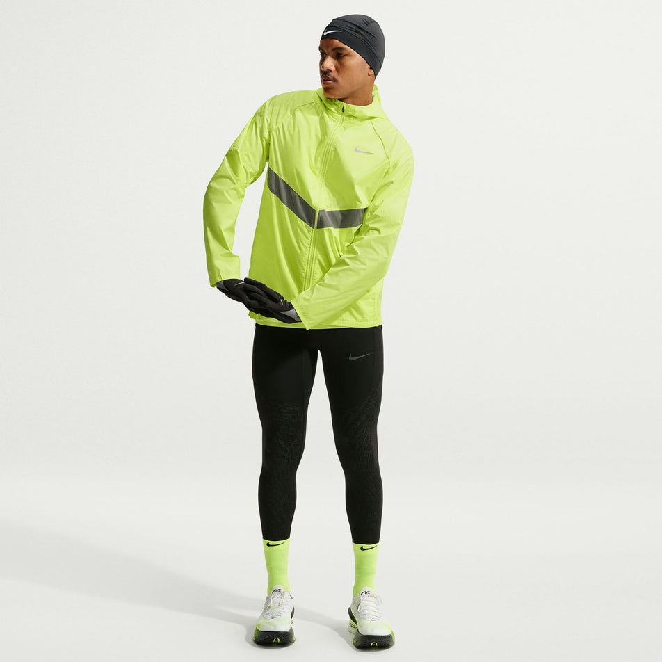 Front view of a model wearing the Nike Men's Miler Therma-FIT Repel Winterized Running Jacket in the Light Lemon Twist colourway.
