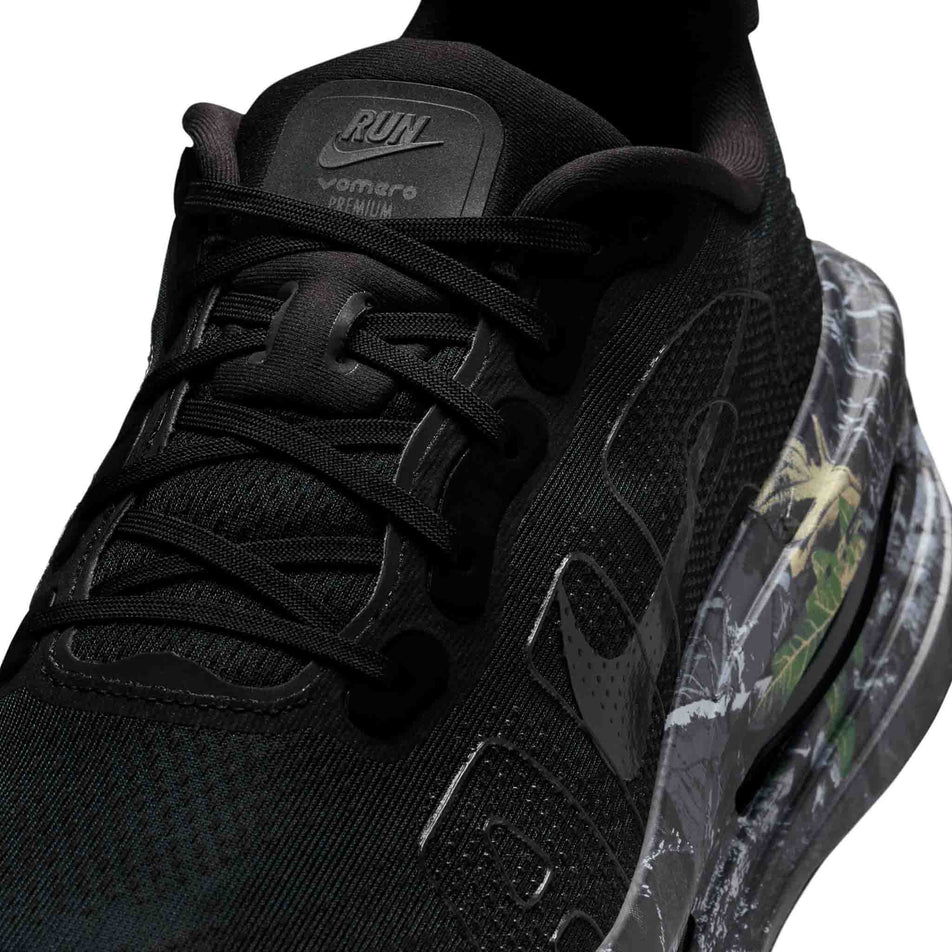 Close-up view of the upper of the left shoe from a pair of Nike Men's Vomero Premium Realtree® Road Running Shoes in the Black/Dark Smoke Grey/Anthracite/Metallic Dark Grey colourway.