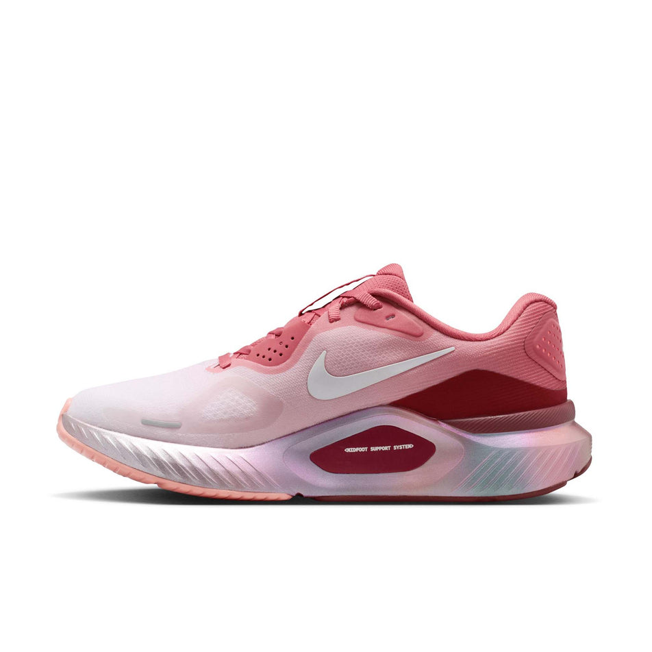 Medial view of the right shoe from a pair of Nike Women's Structure 26 Road Running Shoes in the Light Redwood/Barely Green-Team Red colourway.