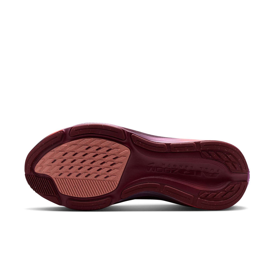 The outsole of the left shoe from a pair of Nike Women's Pegasus 42 SE Road Running Shoes in the Team Red/Barely Green-Atomic Pink colourway.