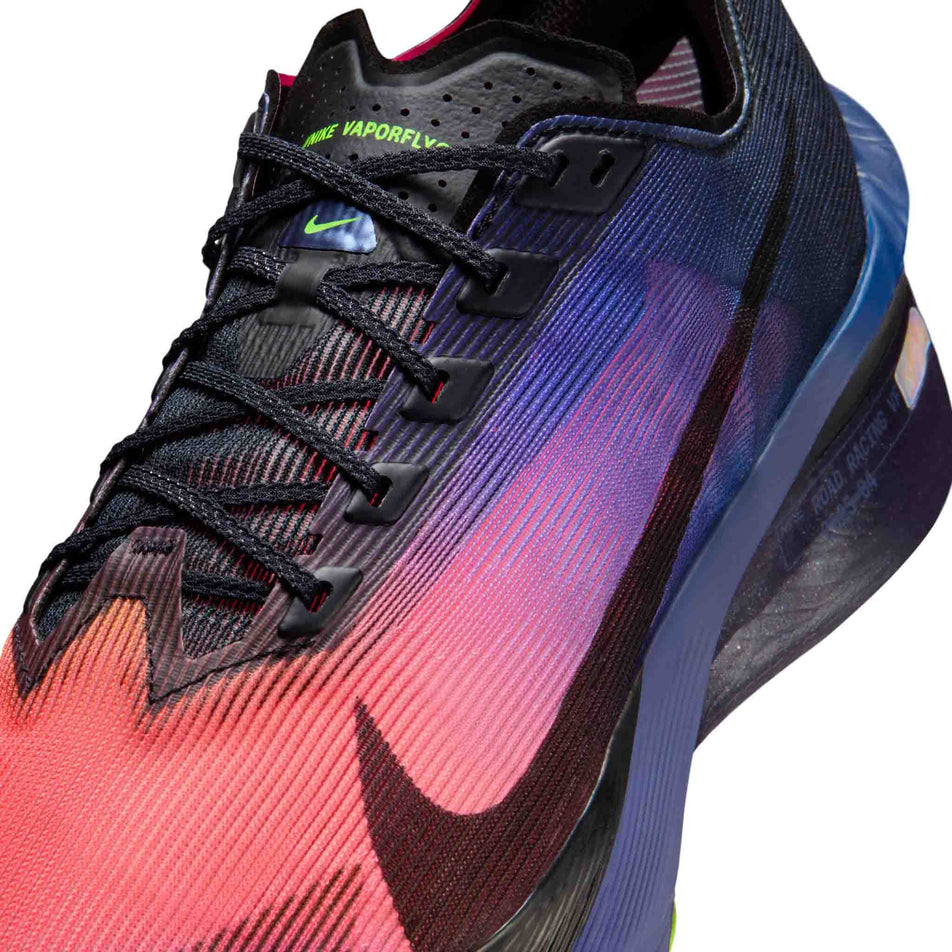 Close-up view of the upper of the left shoe from a pair of Nike Men's Vaporfly 4 Glam Road Racing Shoes in the Dark Obsidian/Black-Purple Dynasty colourway.