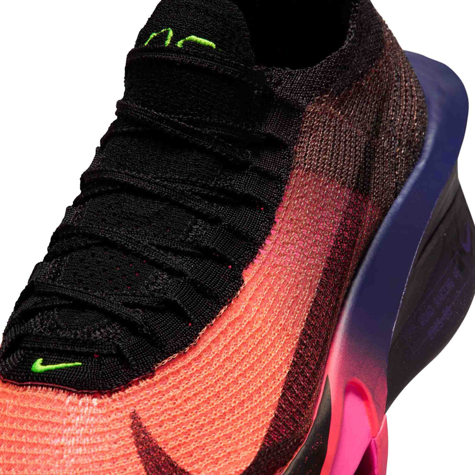 Close-up view of the upper of the left shoe from a pair of Nike Men's Alphafly 3 Road Racing Shoes in the Orange Pulse/Black-Purple Dynasty colourway.