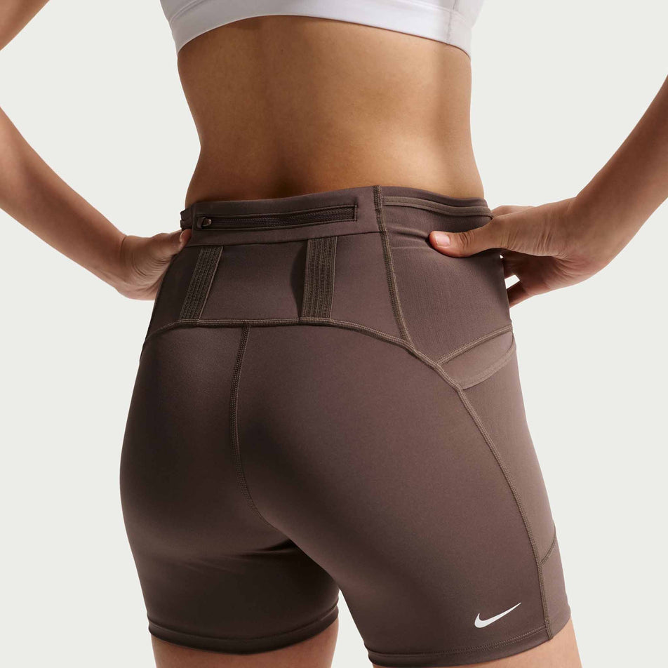 Back view of a model wearing the Nike Women's ACG Dri-FIT High-Waisted 4