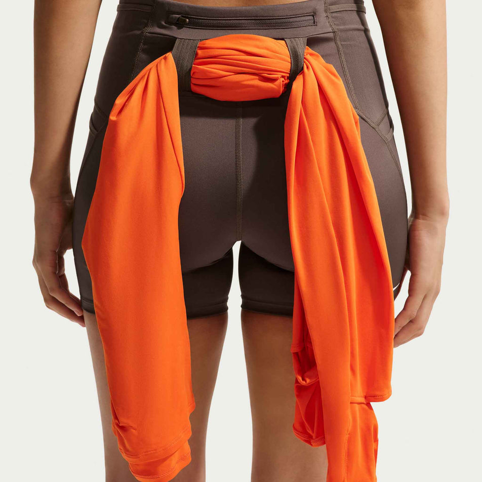 A top stashed in the loops on the back of the Nike Women's ACG Dri-FIT High-Waisted 4