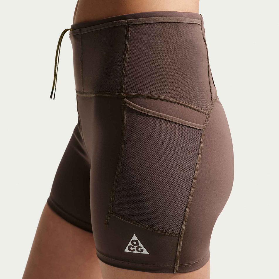 Side view of a model wearing the Nike Women's ACG Dri-FIT High-Waisted 4