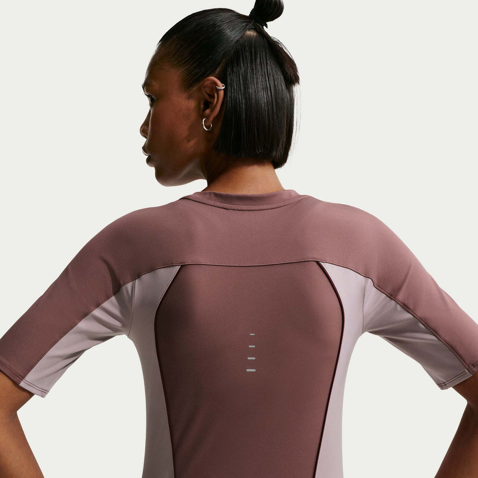 Back view of the Nike Women's Swift Dri-FIT Short-Sleeve Running Top in the Tattoo/Light Violet Ore/Reflective Silver colourway.