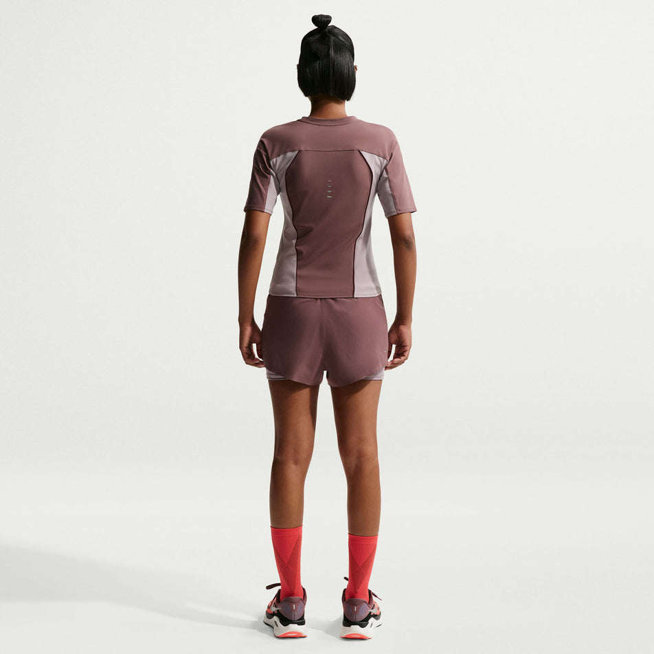Back view of the Nike Women's Swift Dri-FIT Short-Sleeve Running Top in the Tattoo/Light Violet Ore/Reflective Silver colourway.