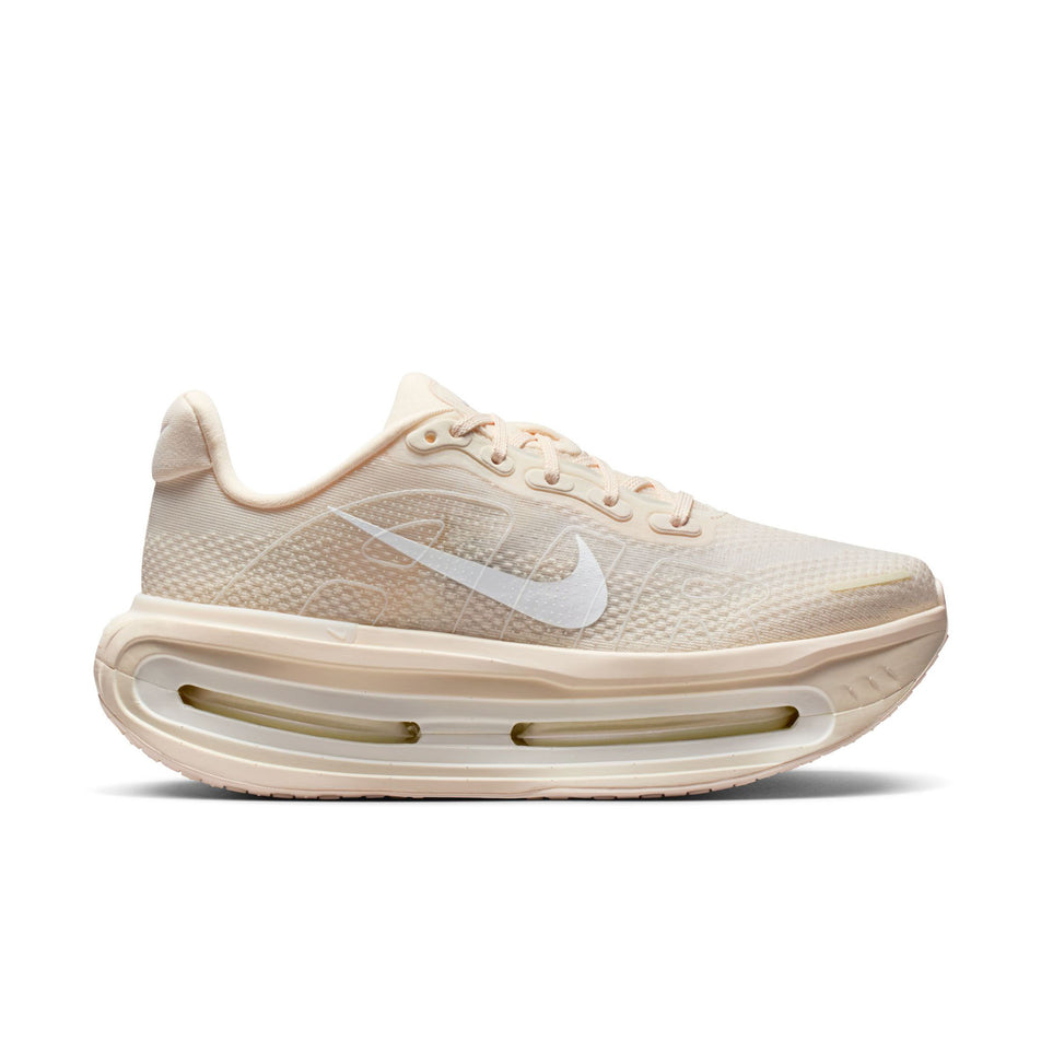 Lateral view of the right shoe from a pair of Nike Women's Vomero Premium Road Running Shoes in the Chalk/White-Pale Ivory-Summit White colourway.