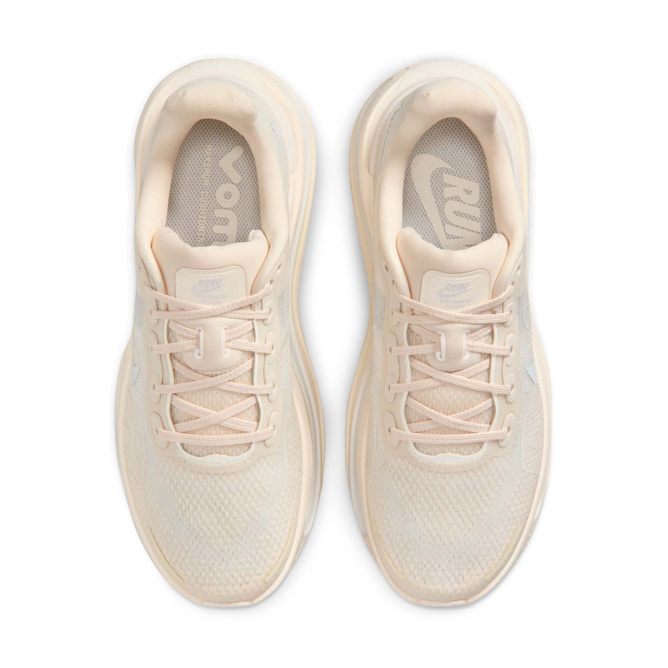 The uppers of a pair of Nike Women's Vomero Premium Road Running Shoes in the Chalk/White-Pale Ivory-Summit White colourway.