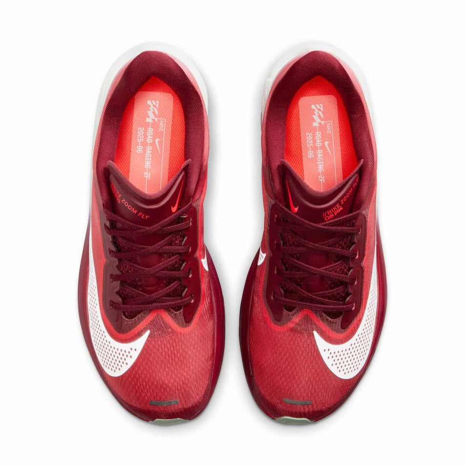 The uppers of a pair of Nike Women's Zoom Fly 6 SE Road Running Shoes in the Team Red/Barely Green-Bright Crimson colourway.