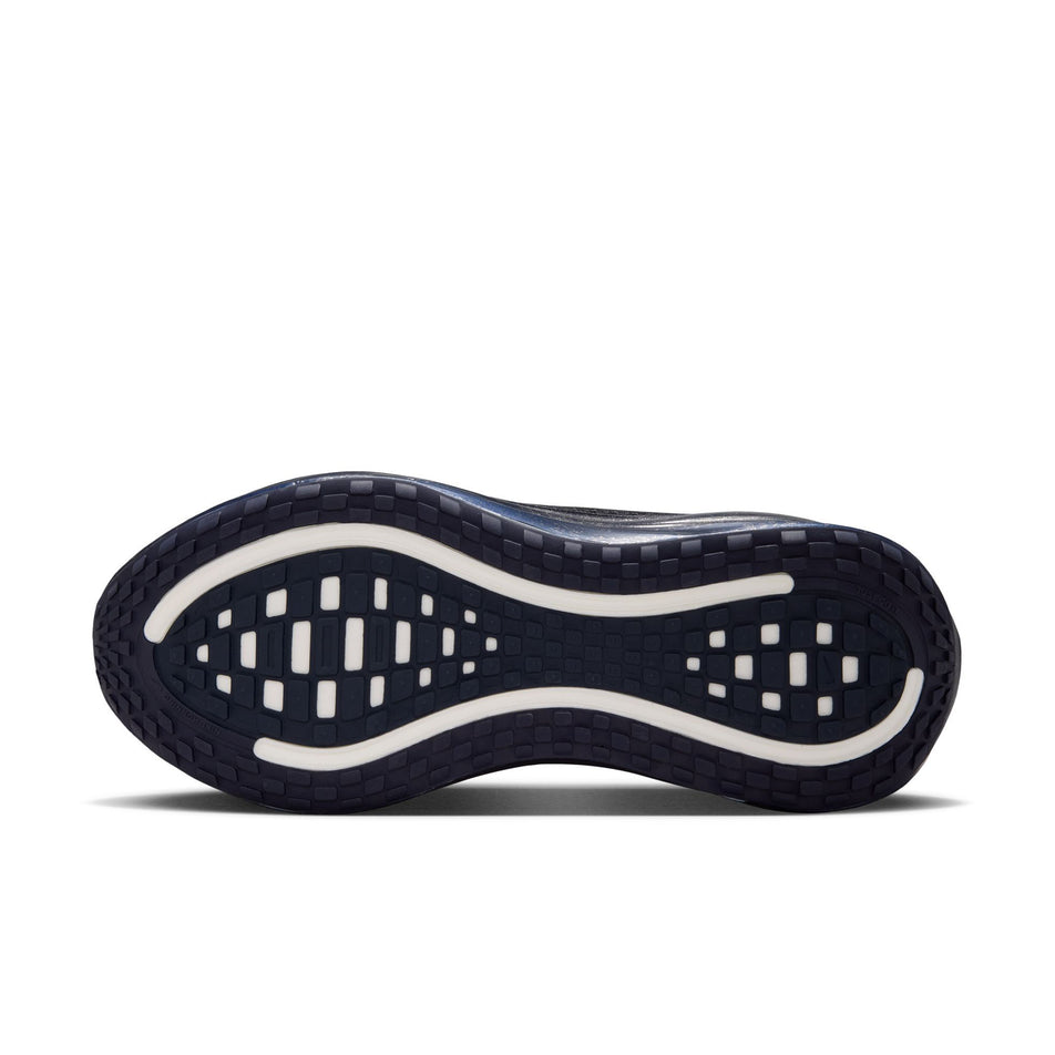 The outsole of the left shoe from a pair of Nike Women's Vomero Plus