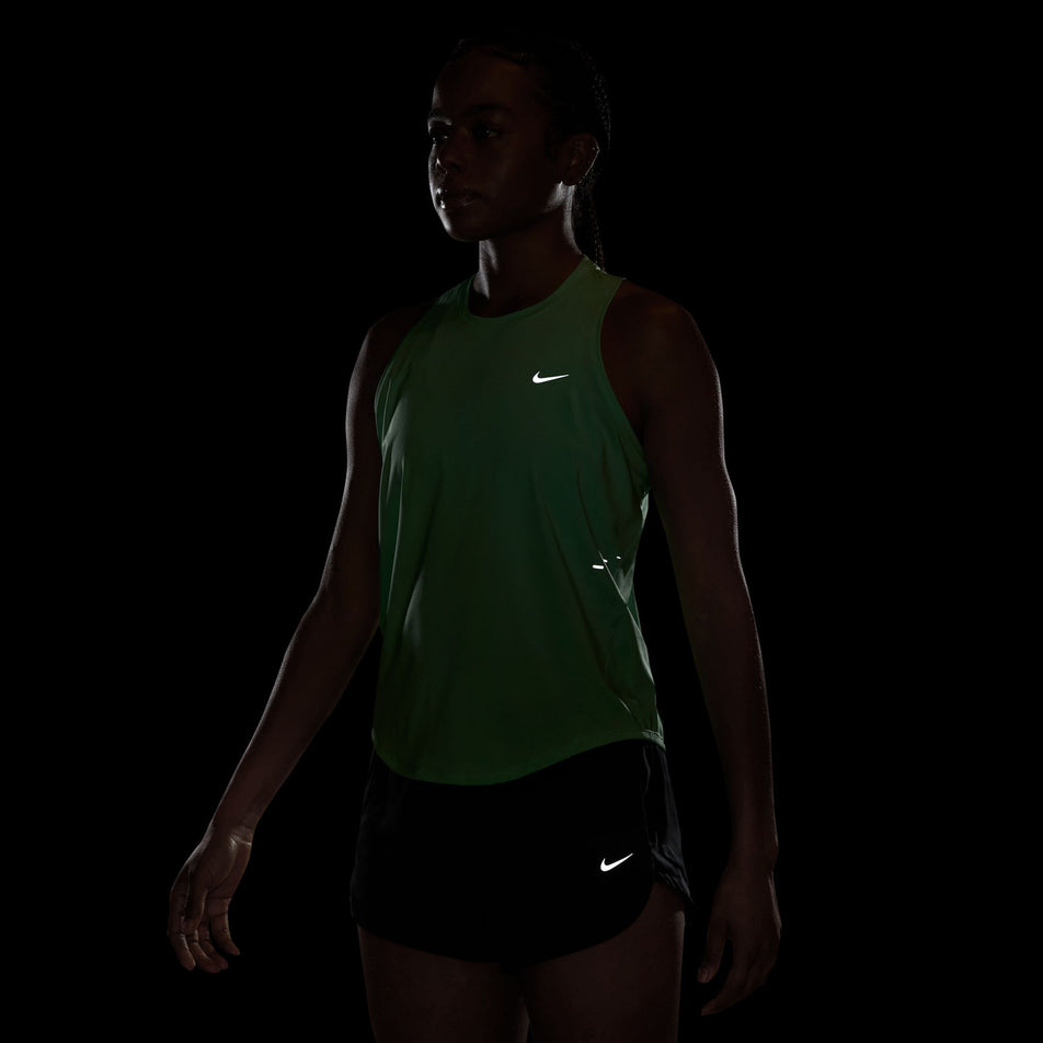 The reflective details on the Nike Women's Swift Dri-FIT Running Tank Top in the Illusion Green/Reflective Silver colourway.