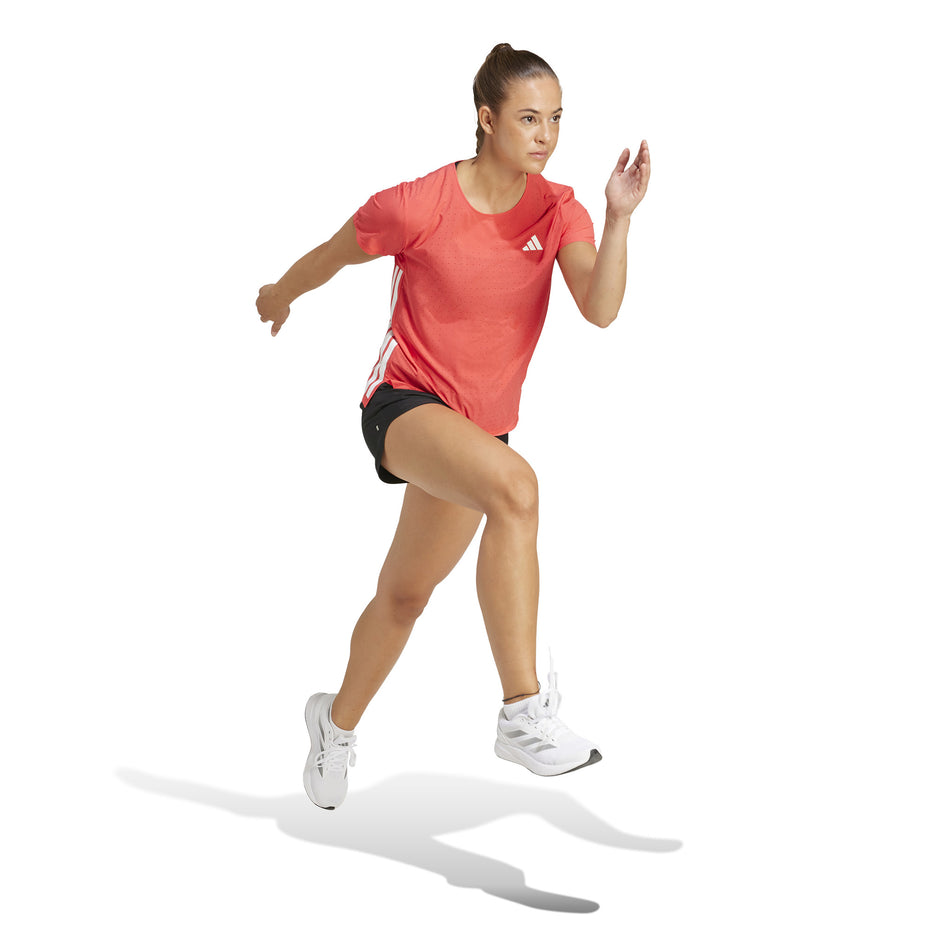 Front view of a model wearing the adidas Women's Adizero Tee in the Semi Lucid Red colourway. (8567020880034)