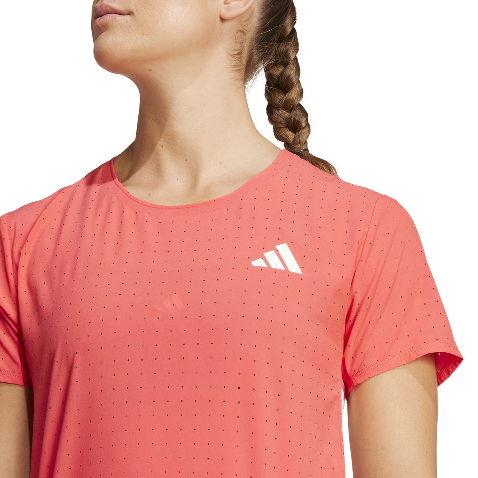 Front view of a model wearing the adidas Women's Adizero Tee in the Semi Lucid Red colourway. (8567020880034)