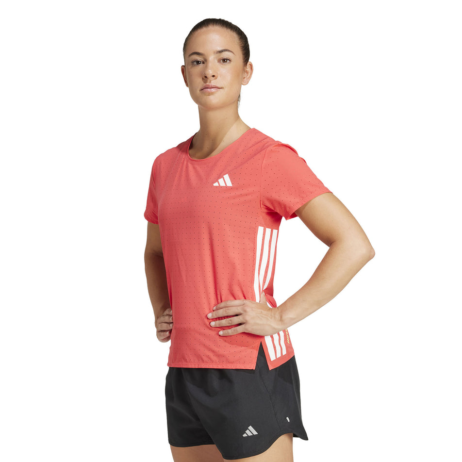 Front view of a model wearing the adidas Women's Adizero Tee in the Semi Lucid Red colourway. (8567020880034)