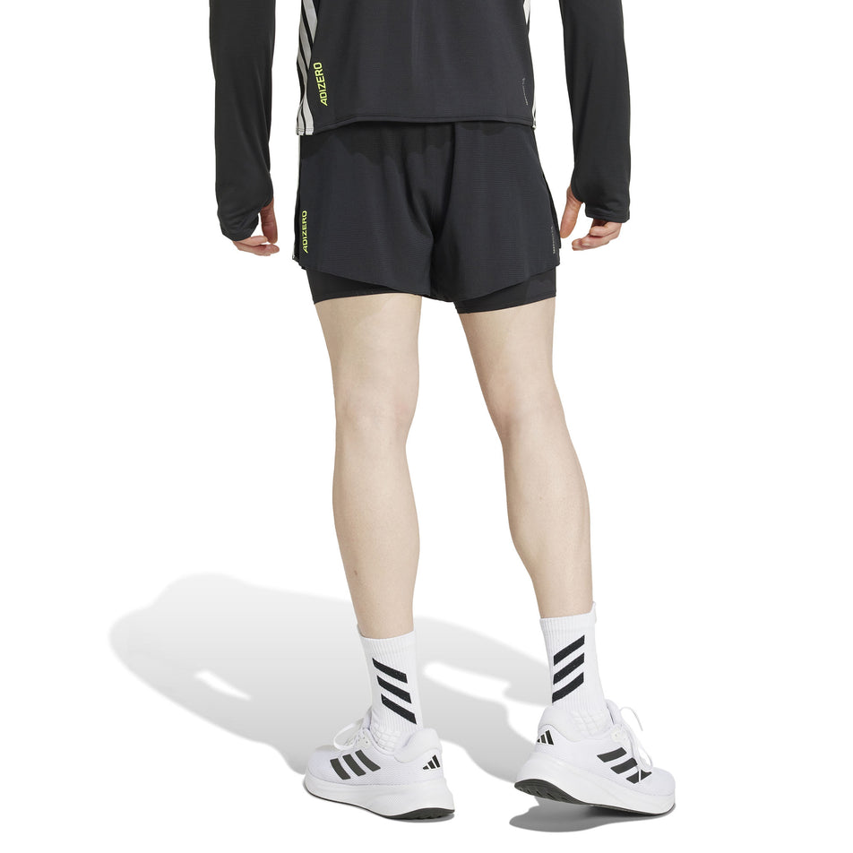 Back view of a model wearing the adidas Men's Adizero 2in1 Short in the Black colourway. (8566982148258)