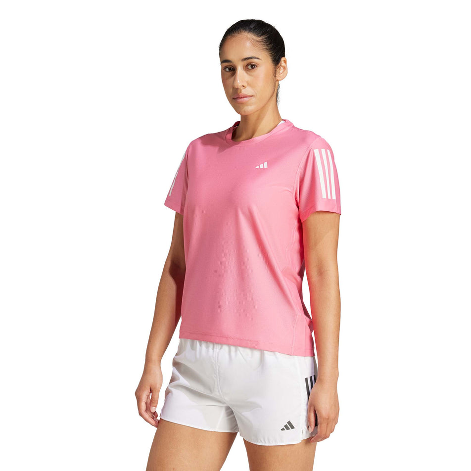 Front view of a model wearing the adidas Women's Own The Run Base Tee in the Pink Fusion colourway. (8567025172642)