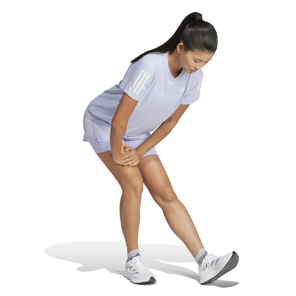 Front view of a model wearing the adidas Women's Own The Run Base Tee in the Violet Tone colourway. (8567459840162)