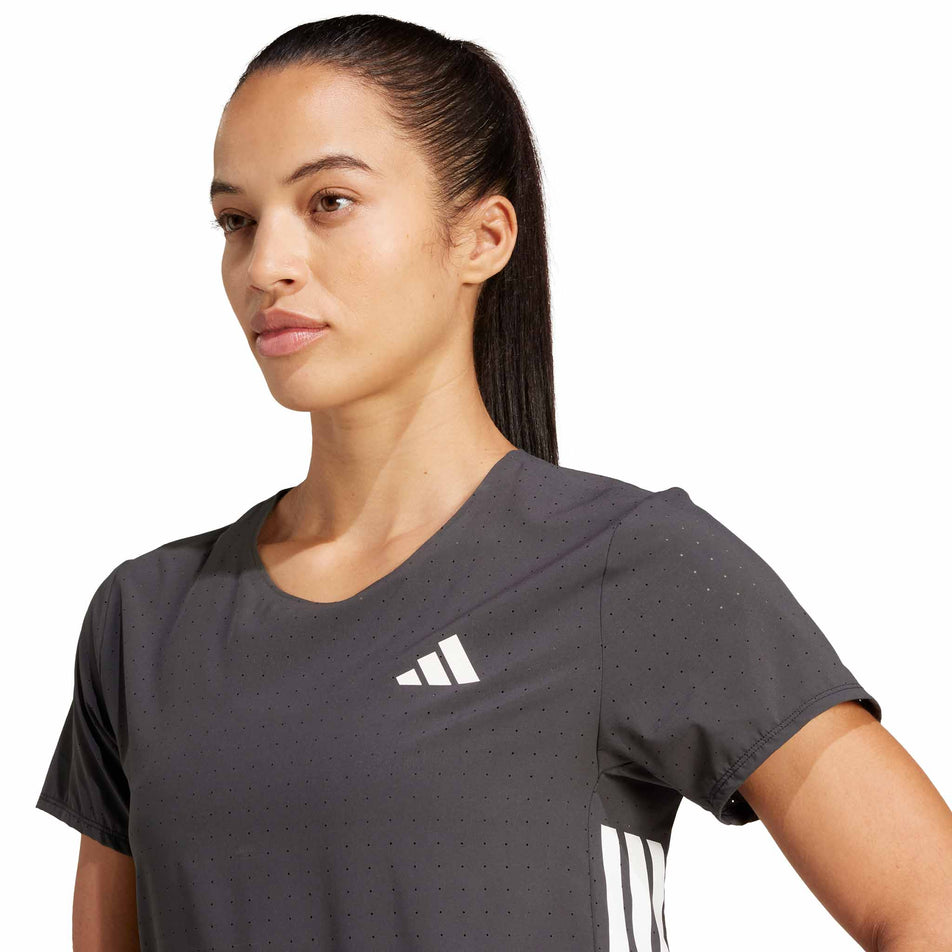 Front view of a model wearing the adidas Women's Adizero Tee in the Black colourway.