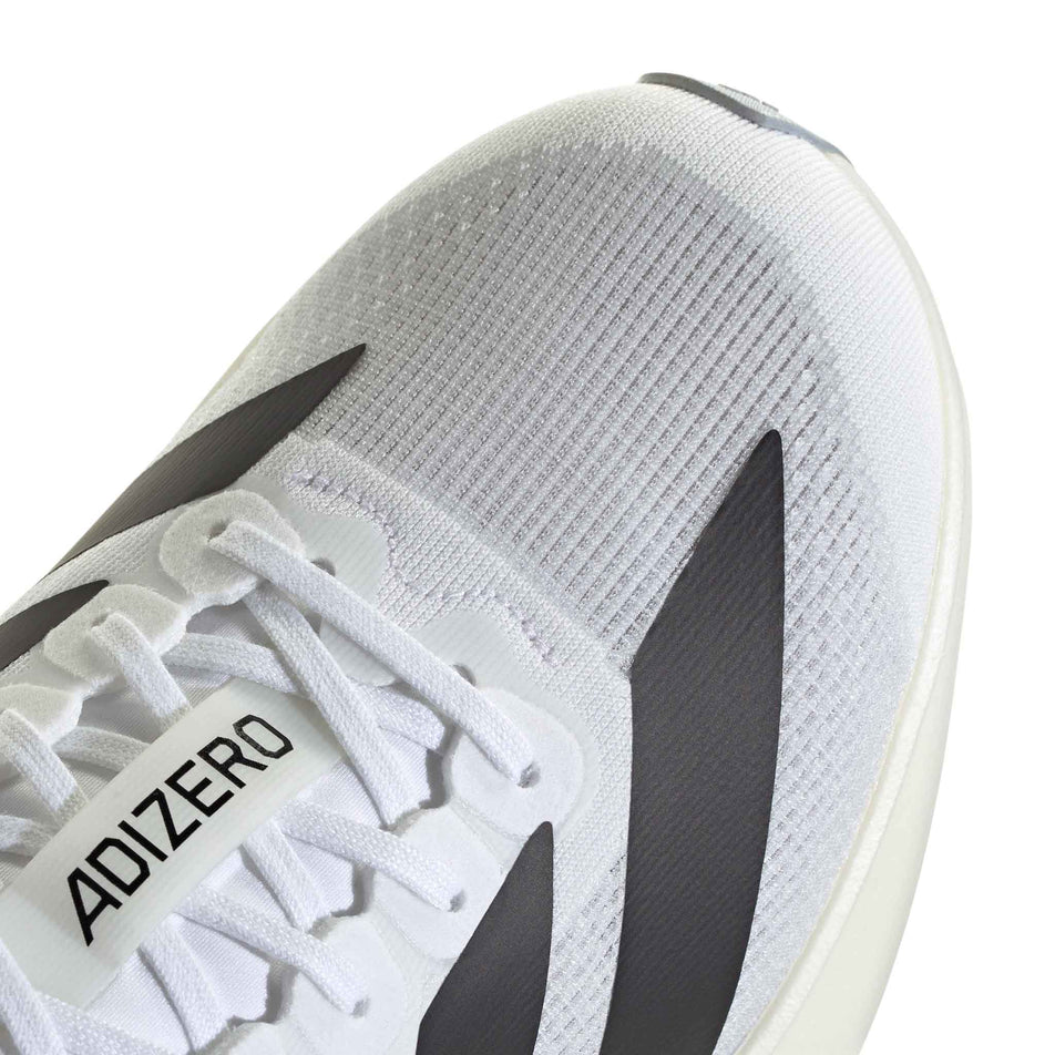 Close-up view of the toebox of the right shoe from a pair of adidas Women's Adizero EVO SL Running Shoes in the Ftwr White/Core Black/Ftwr White colourway.